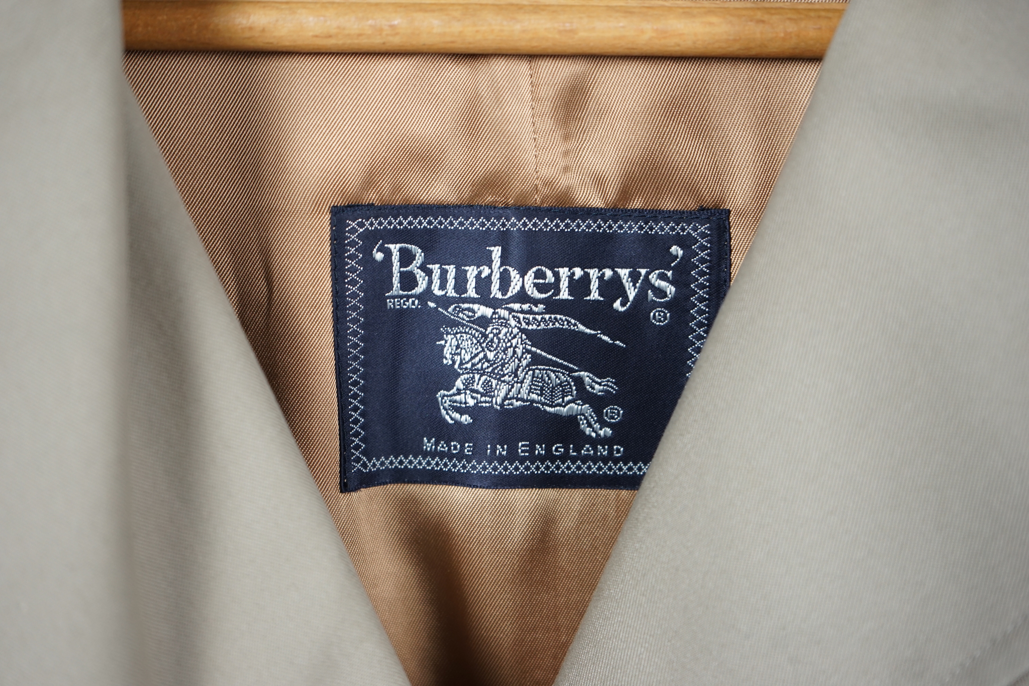 A lady's Burberry trench coat with padded detachable lining, size 12